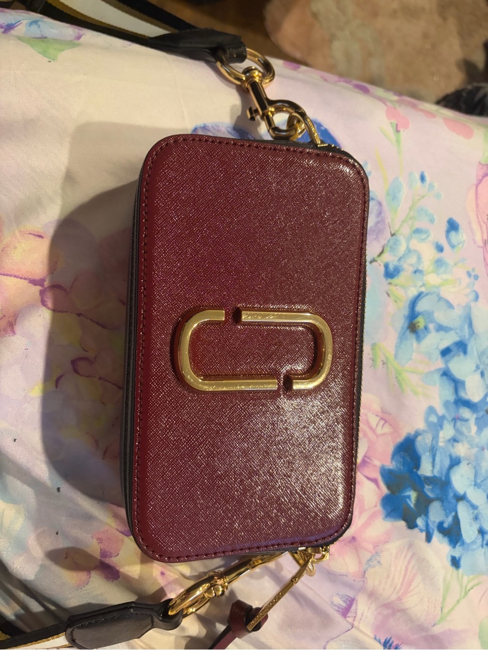 Marc Jacob’s Burgundy Crossbody Bag with Gold Accent